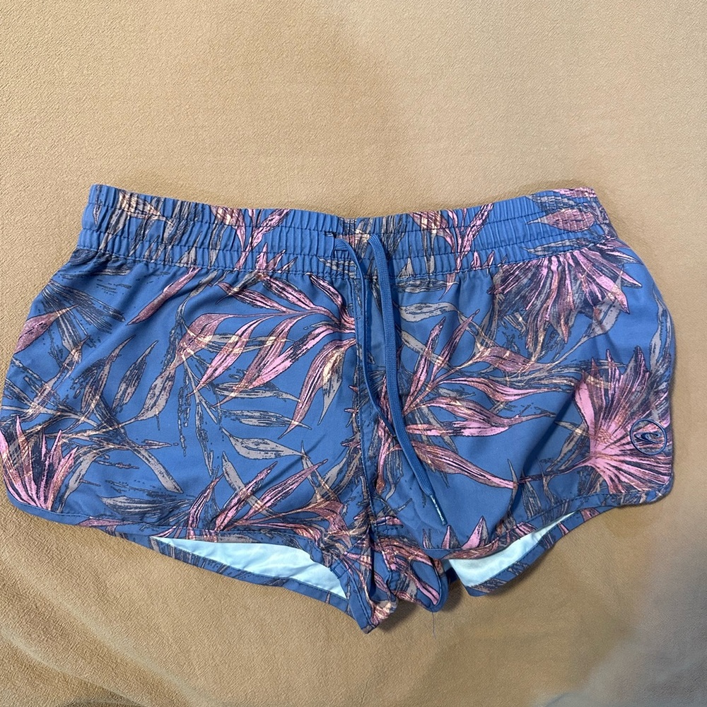 Tropical pink and purple O’Neil swim trunks
